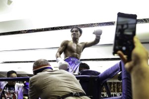 Kenneth Llover raises his hand after defeating Luis Concepcion